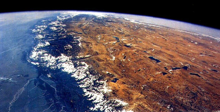 On this photo from cosmos one can see flood-lands of the river Gang (in the left), peaks of Himalayas and Tibetan plateau, covered with snow (in the right). (Photo of NASA)